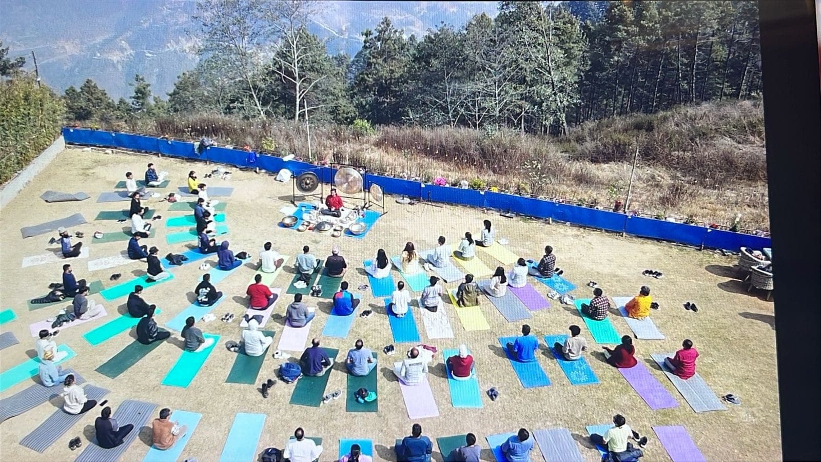 A group sound bath on a Himalayan mountainside
